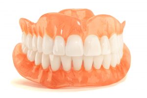 a full set of dentures in front of a white background